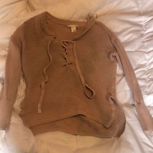 Pink tie up sweater.